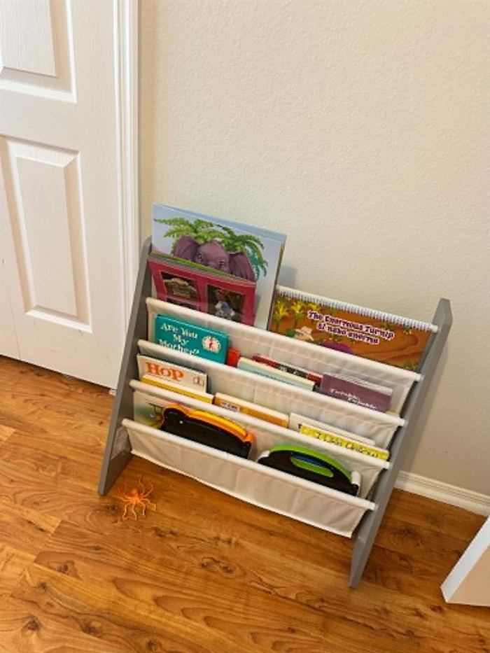 Children's bookshelf stocked with picture books used for daily story time